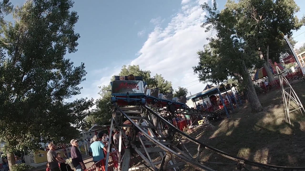 Kiddie coaster car approaching from upper track