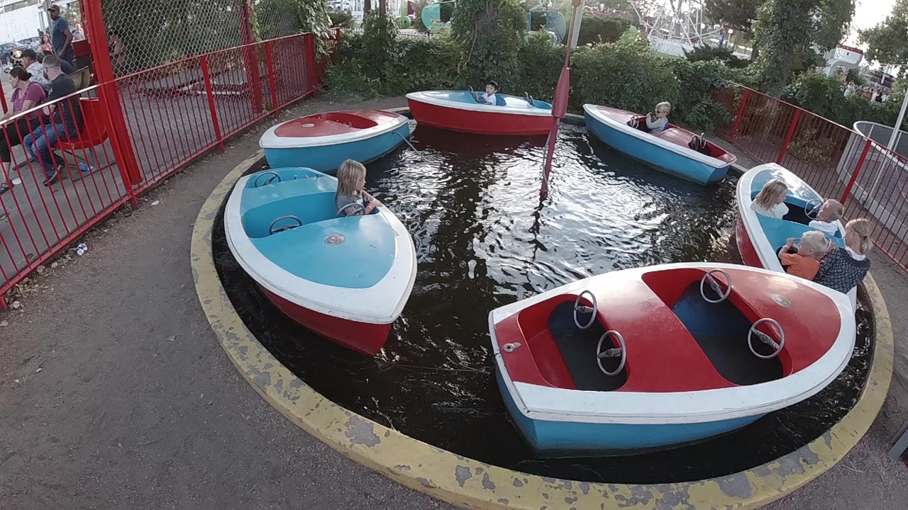 Speedboat carousel boats in a circular water ride