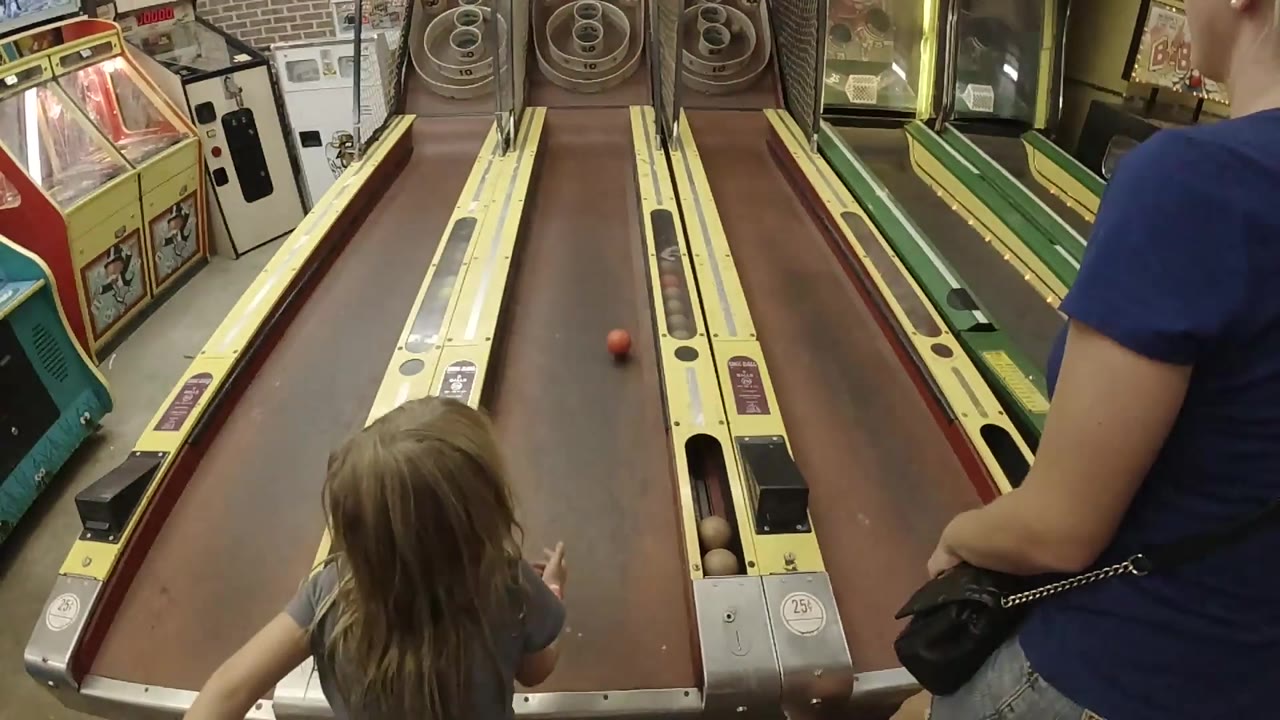 Red ball halfway up skee-ball lane