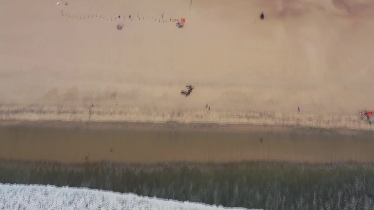 Sandy shoreline with surf band