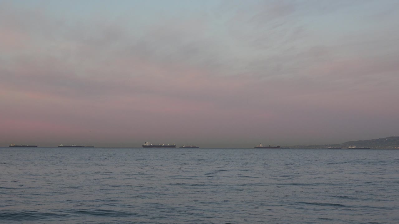 Offshore tanker group under muted dusk sky