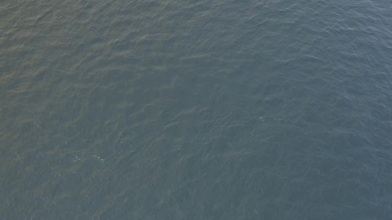 At two seconds, the Baja California Sur water appears smoother across the center, with fine ripples, muted blue color, and no visible people.