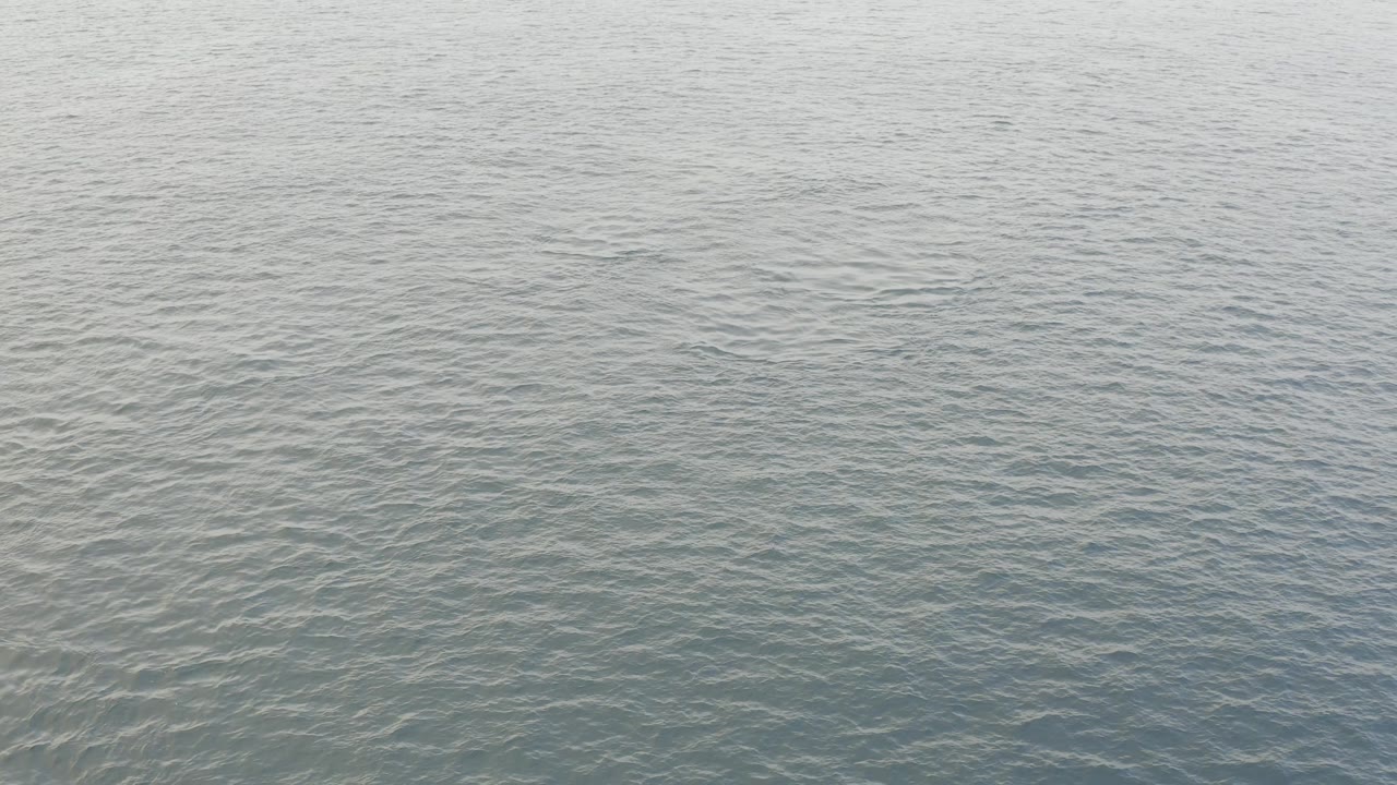 Open ocean water in Baja California Sur, Mexico, shown as a full-frame blue-gray surface with gentle ripple patterns and no visible people.