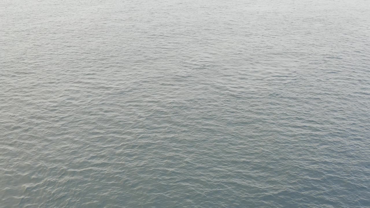 Blue-gray sea surface in Baja California Sur, Mexico, with overlapping small ripples across the frame and no visible people.