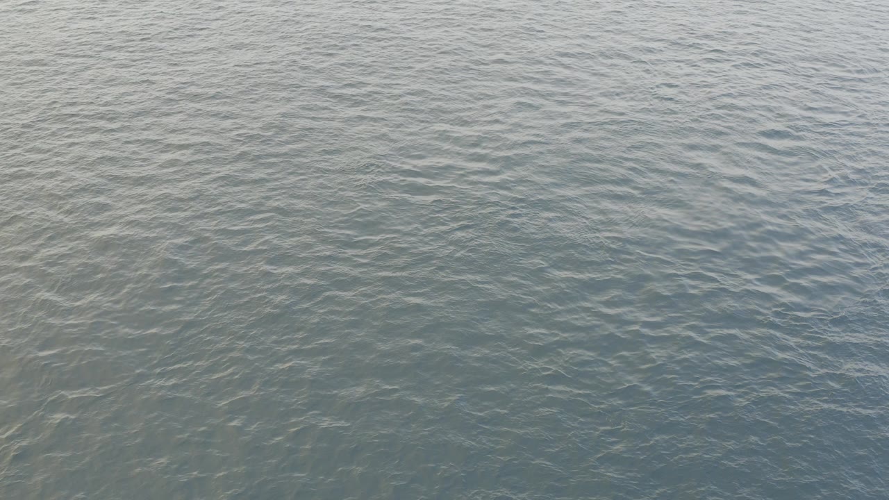 Opening frame of blue-green ocean water in Baja California Sur, Mexico, with small ripples and no visible people or land.