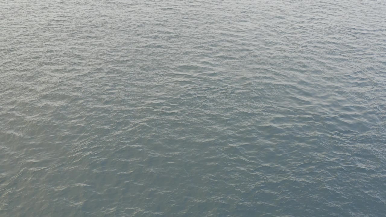 Mid-clip view of open Baja California Sur water with fine wave texture, gray-blue highlights, and no visible people, boats, or shoreline.