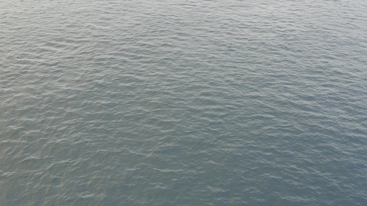 Blue green water surface in Baja California Sur, Mexico, filling the frame with fine ripples and no visible people.
