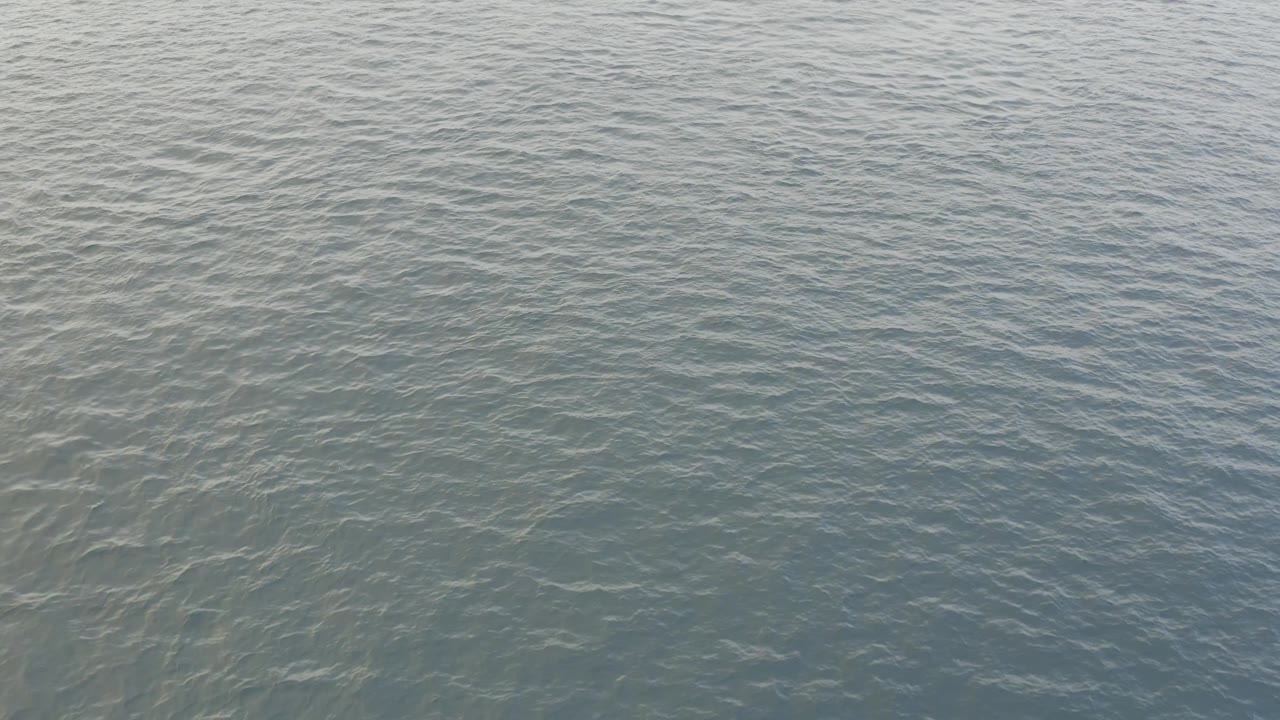 Rippling Baja California Sur ocean water with faint pale areas under or on the surface and no visible people.