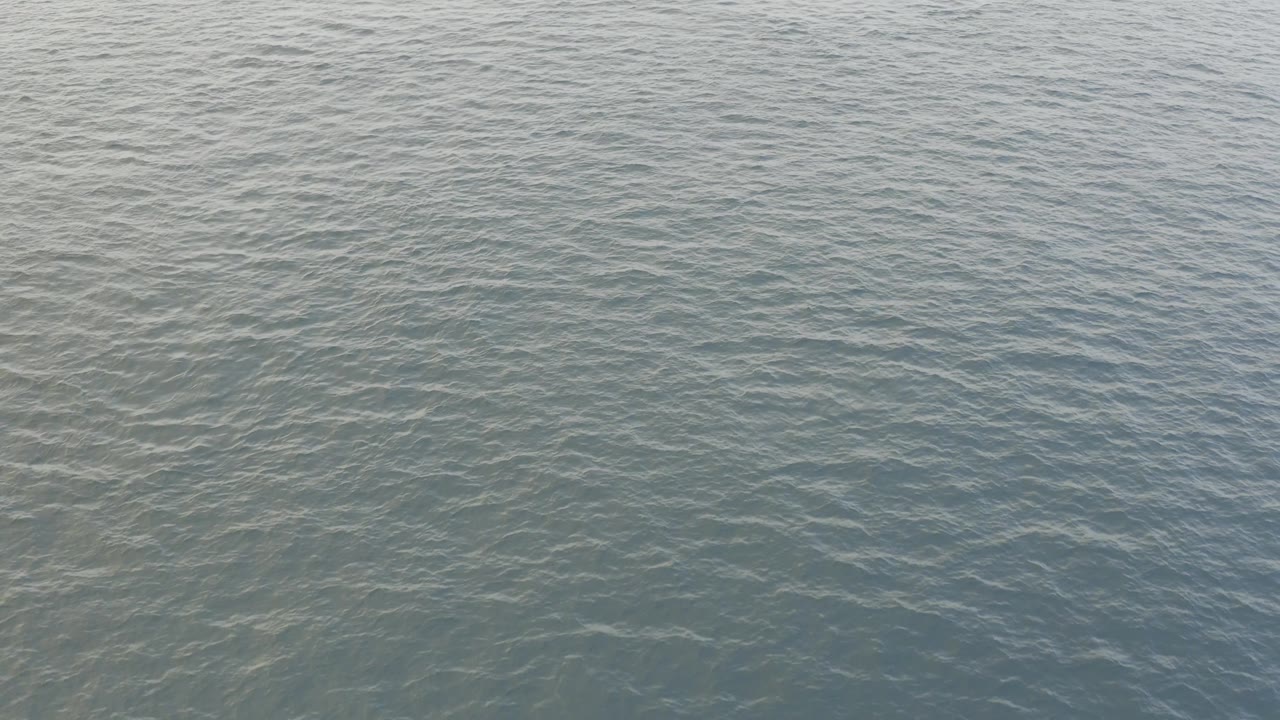 Close water-surface view from Baja California Sur, Mexico, with calm ripples filling the full frame and no visible people.