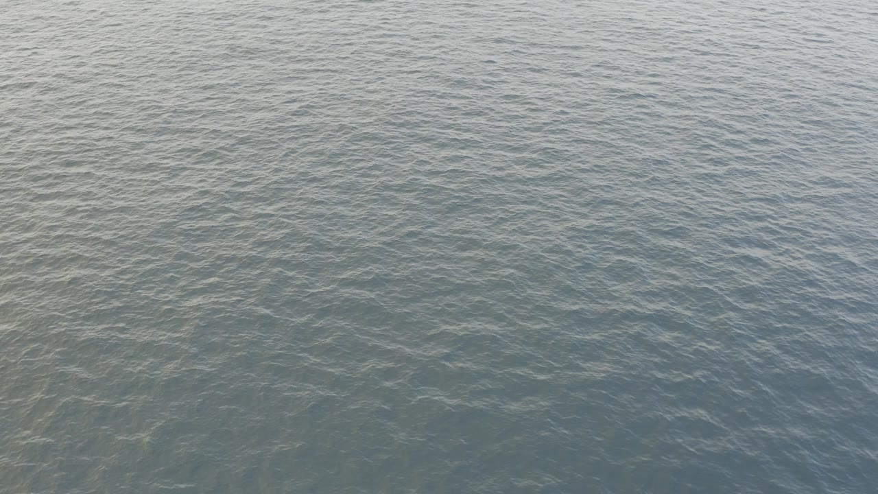 Aerial view of gray blue ocean surface in Baja California Sur, Mexico, with fine ripples across the water and no visible people.