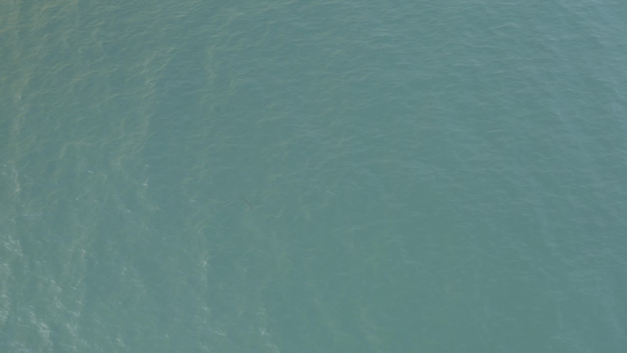 Open aqua water in Baja California Sur fills the view with light wave texture and no visible people.