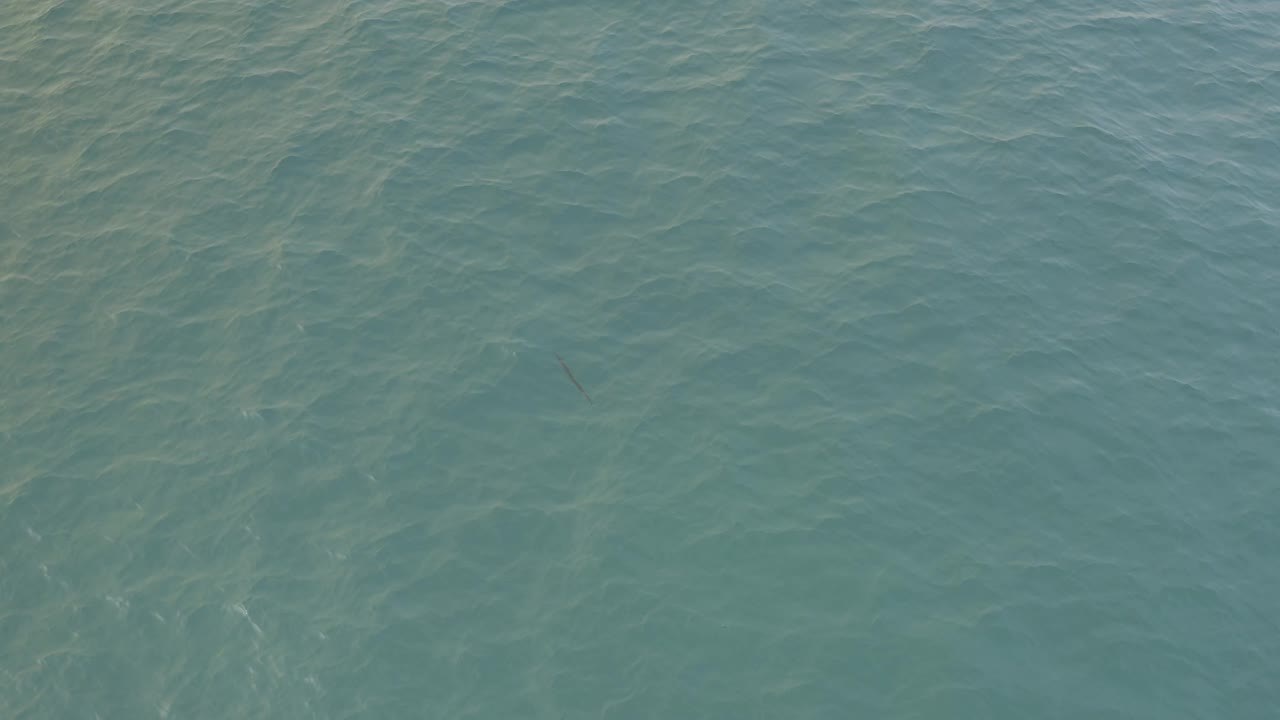 At 0:03, clear Baja California Sur ocean water fills the frame with diagonal ripple patterns and no visible people.