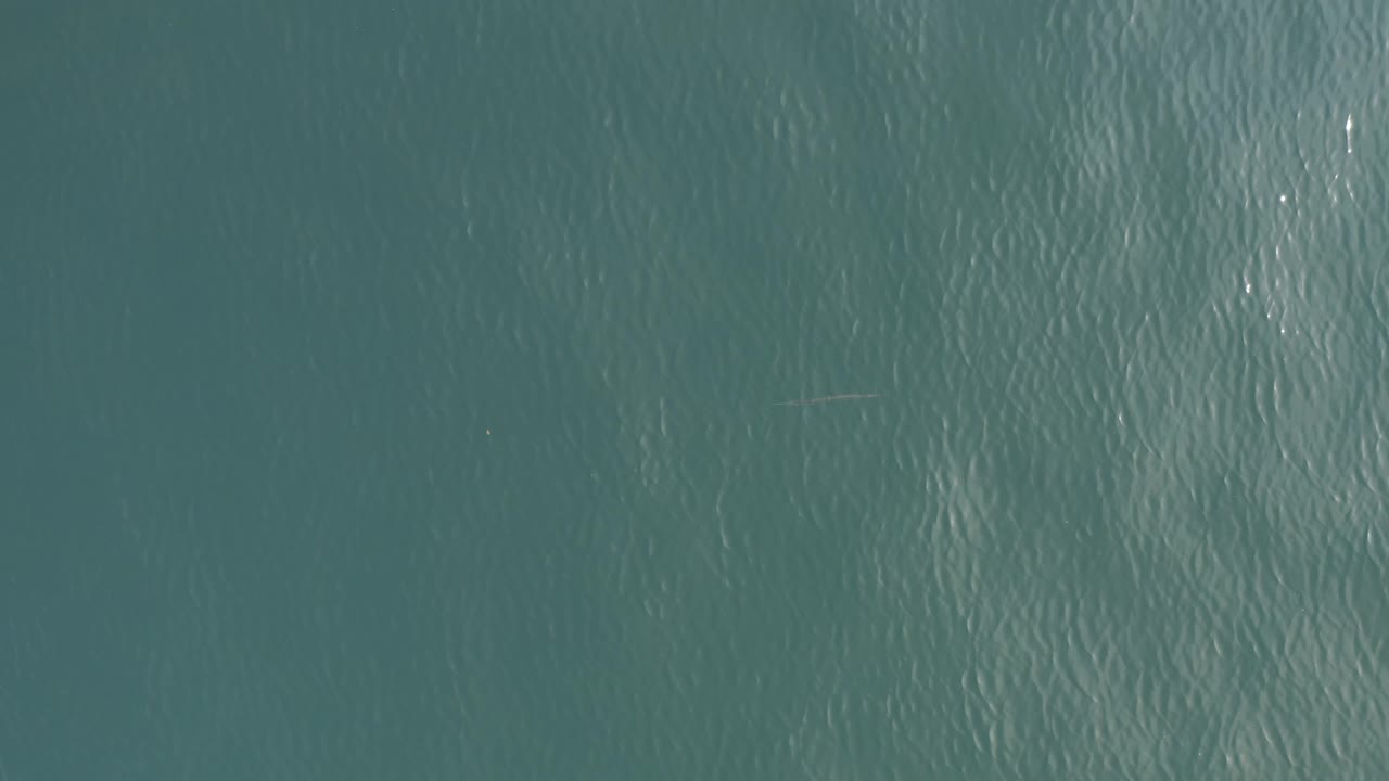 Rippled turquoise water viewed from directly above