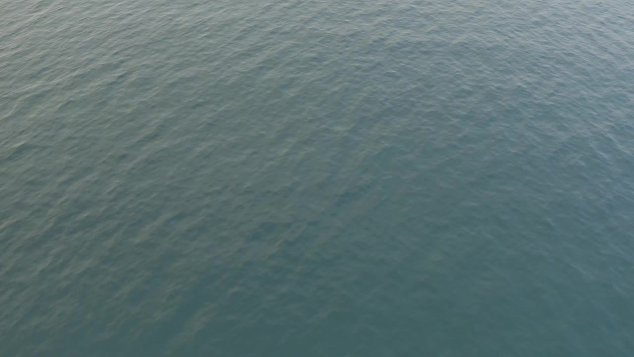 Overhead view of blue-green water in Baja California Sur, Mexico, with fine ripples across the surface and no visible people.