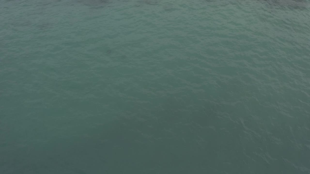 Open blue green water in Baja California Sur, Mexico, with darker patches below the surface and no visible people.
