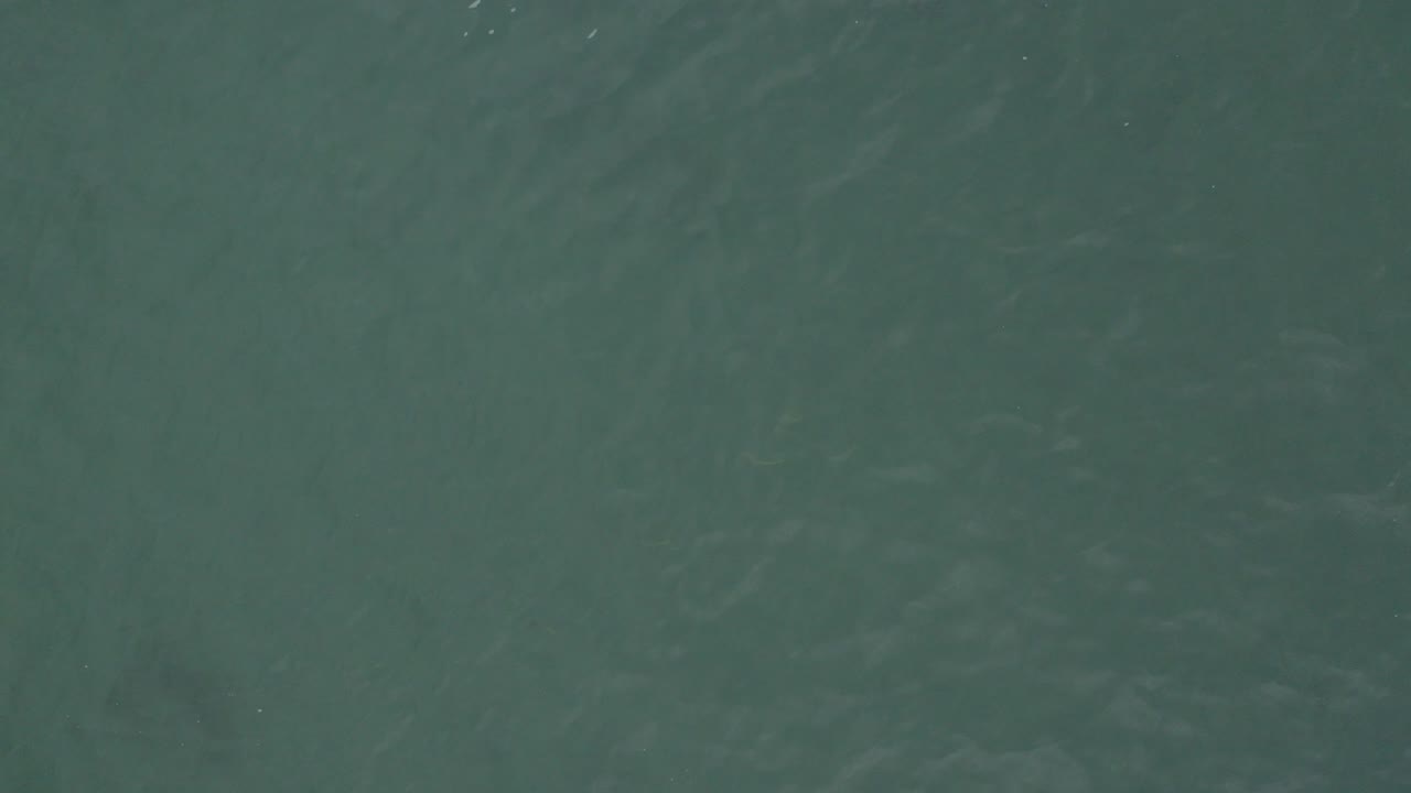 Green-blue ocean surface in Baja California Sur, Mexico, with faint ripples and no visible people.