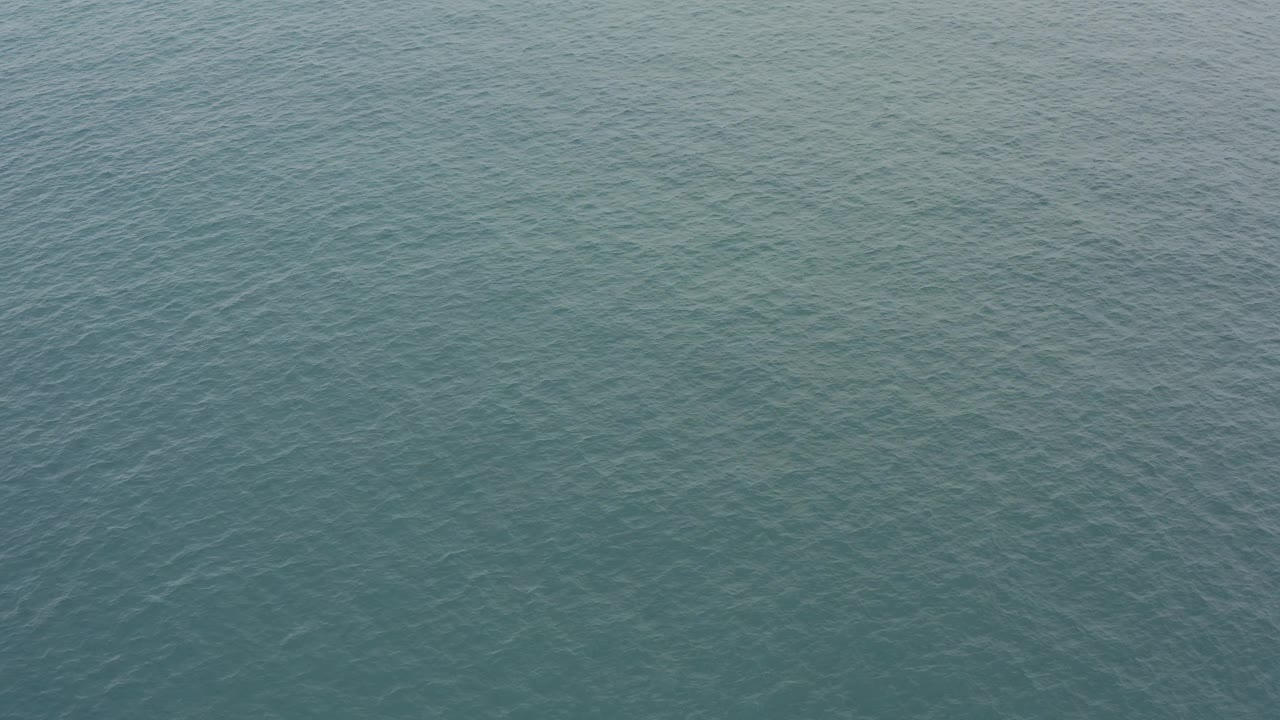 Textured ocean water in Baja California Sur shows a uniform field of small ripples under soft daylight, with no visible people or objects.