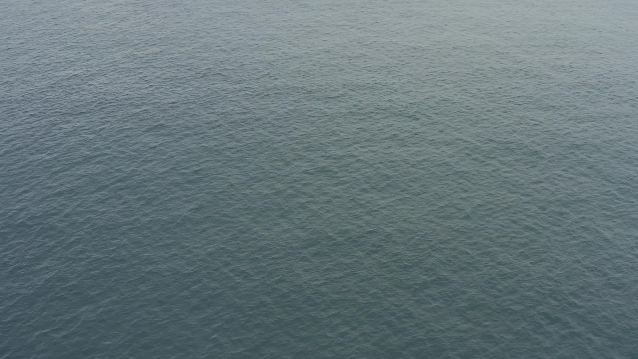 Baja California Sur sea surface appears lighter in this frame, with small ripples spread evenly across the water and no visible people.