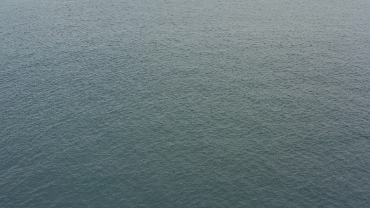 Open ocean water with fine wave texture.