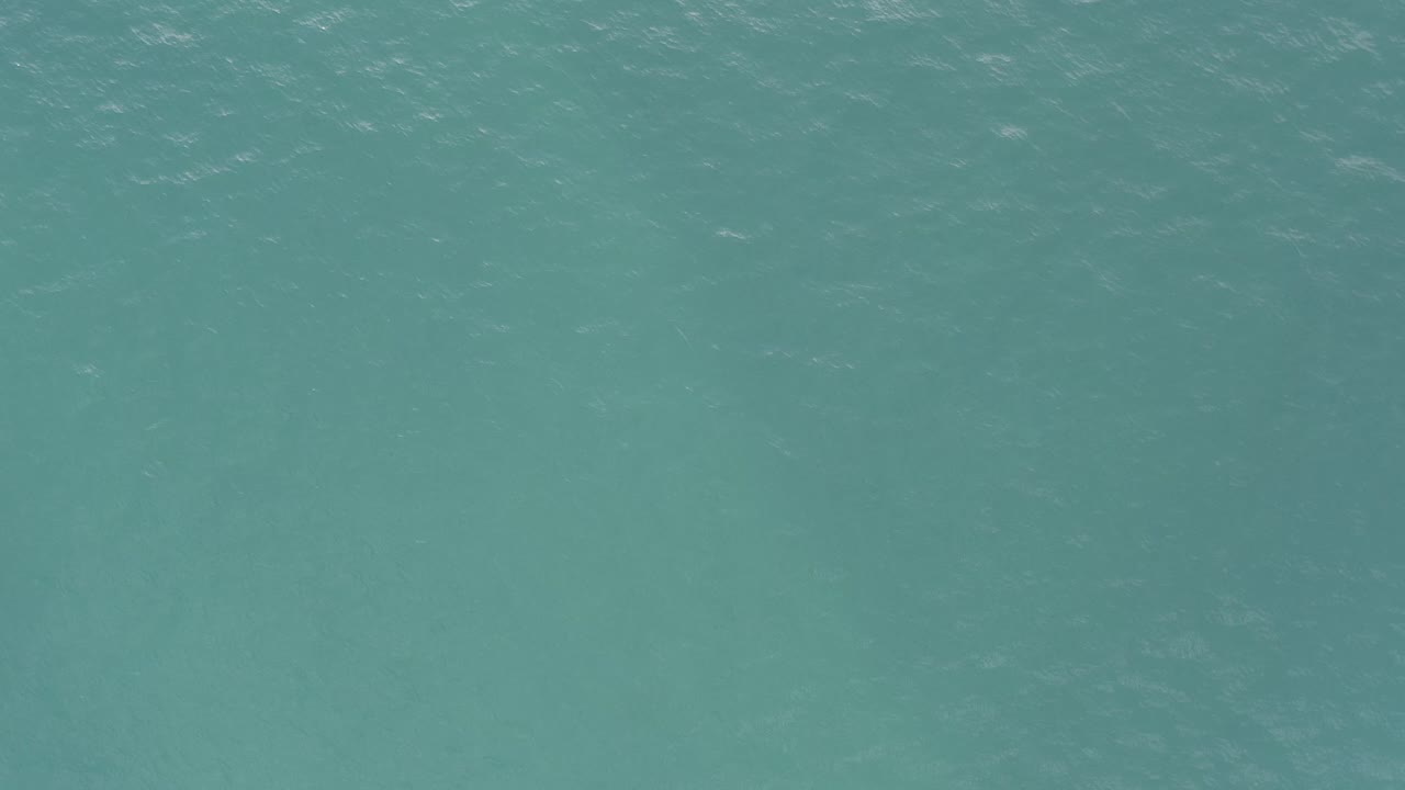 Overhead view of green-blue ocean water in Baja California Sur, Mexico, with small surface ripples and no visible people.