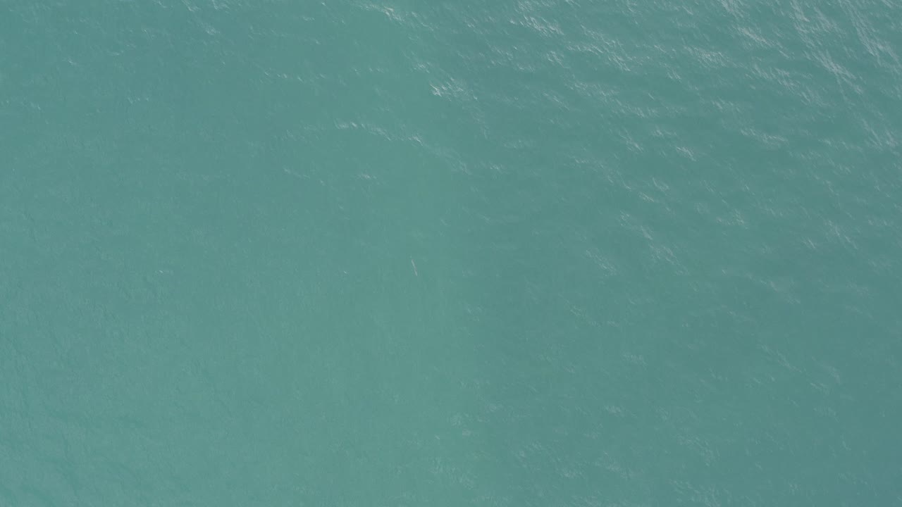 Overhead view of turquoise water in Baja California Sur, Mexico, with fine ripple texture and no visible people.
