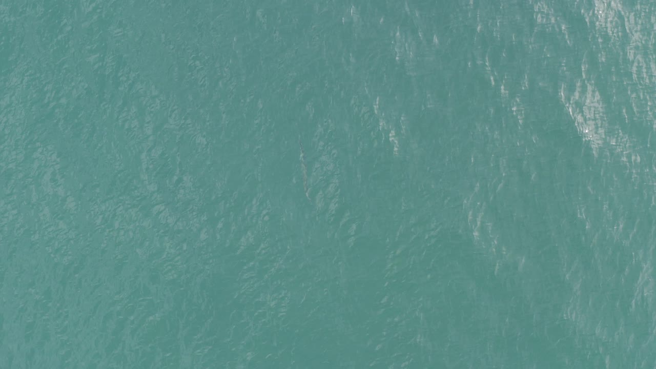 Turquoise ocean surface with fine ripples