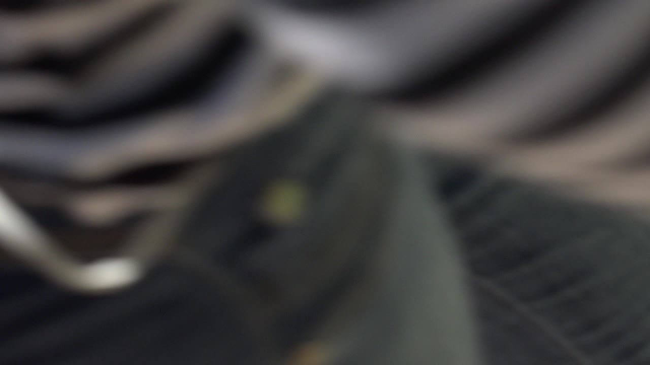 Blurred close foreground beside dark striped fabric.