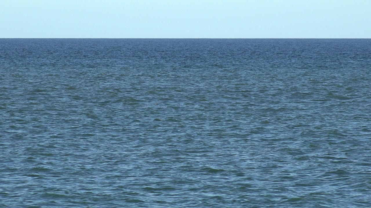 Second frame of the Los Cabos ocean view, with the water texture shifted slightly across the foreground and no visible people.