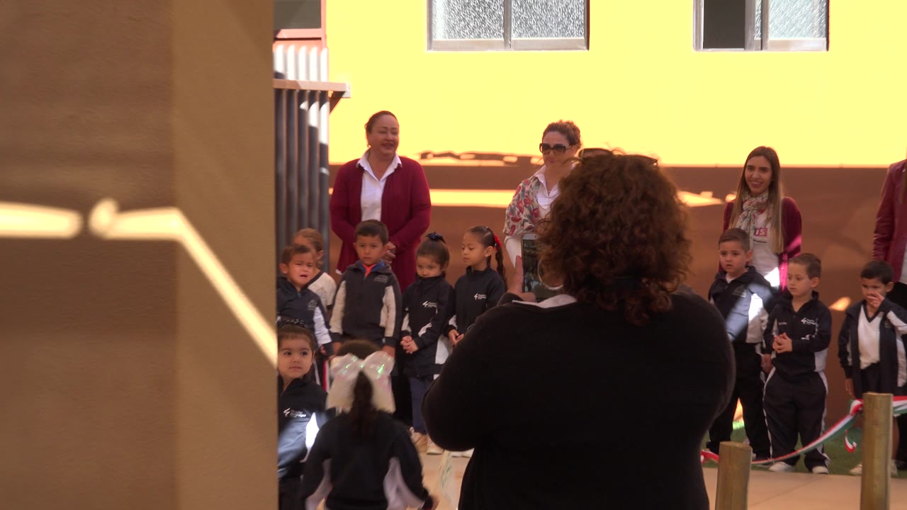 A similar view shows children in uniform at the edge of a San Jose del Cabo school courtyard, with adults behind them and a shaded foreground column partly blocking the scene.