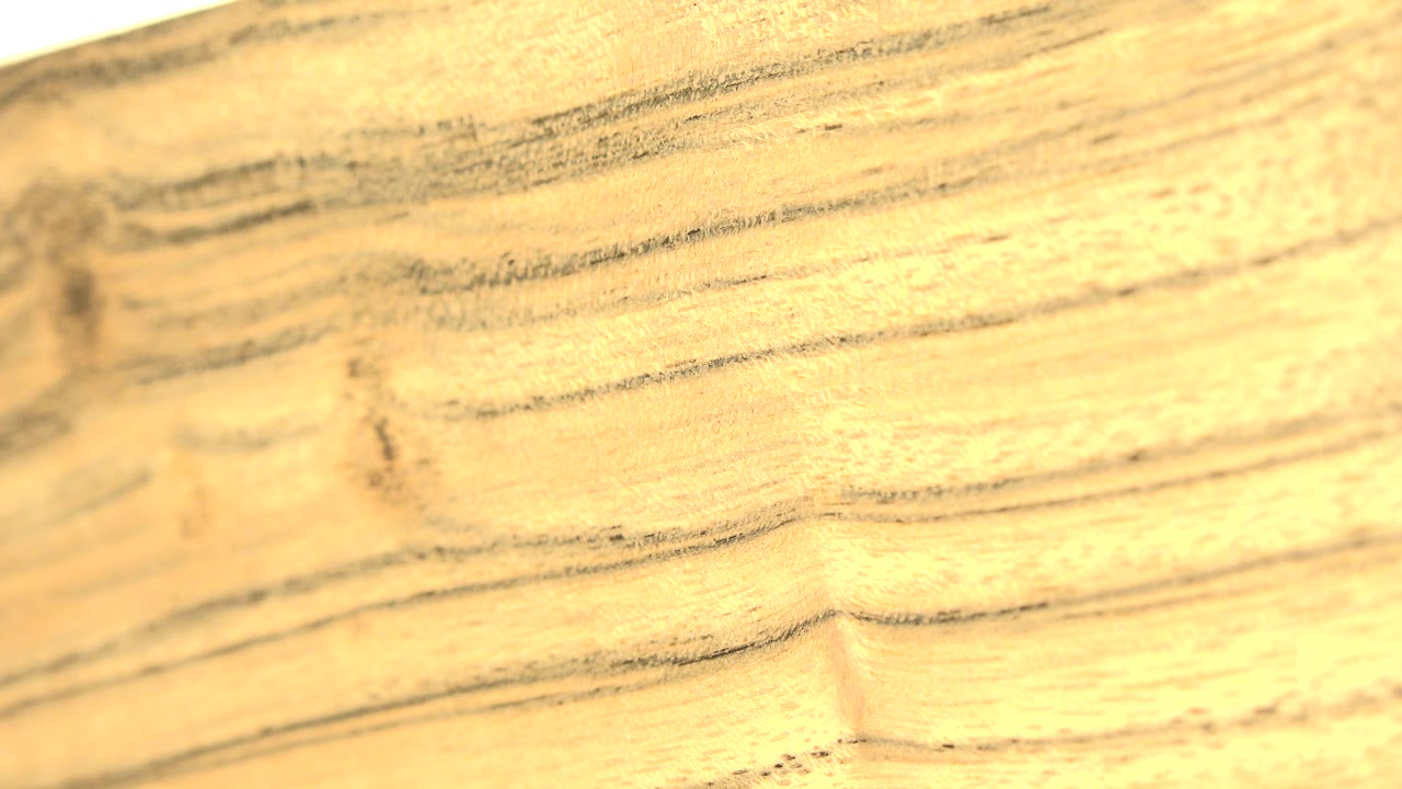 Close view of pale yellow-brown wood grain filling the frame in Westminster, Colorado, with no visible people.