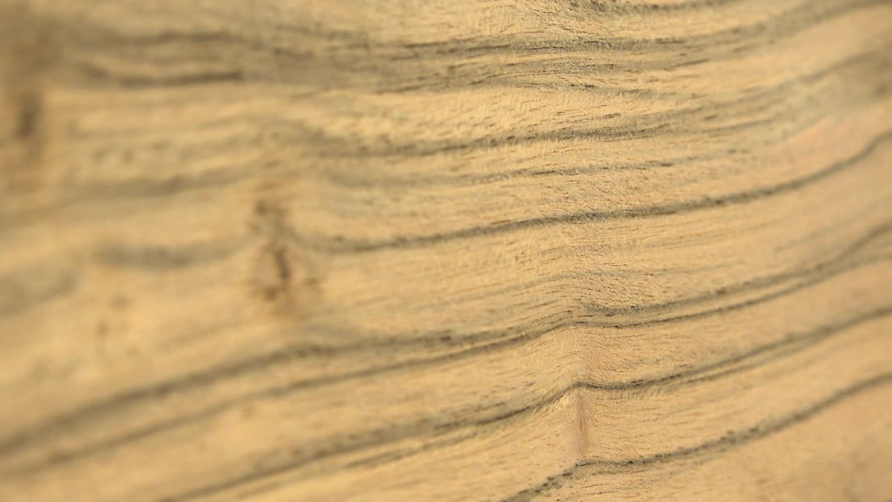 Close view of a tan topography-like image in Westminster, Colorado, with dark horizontal contour lines and no visible people.