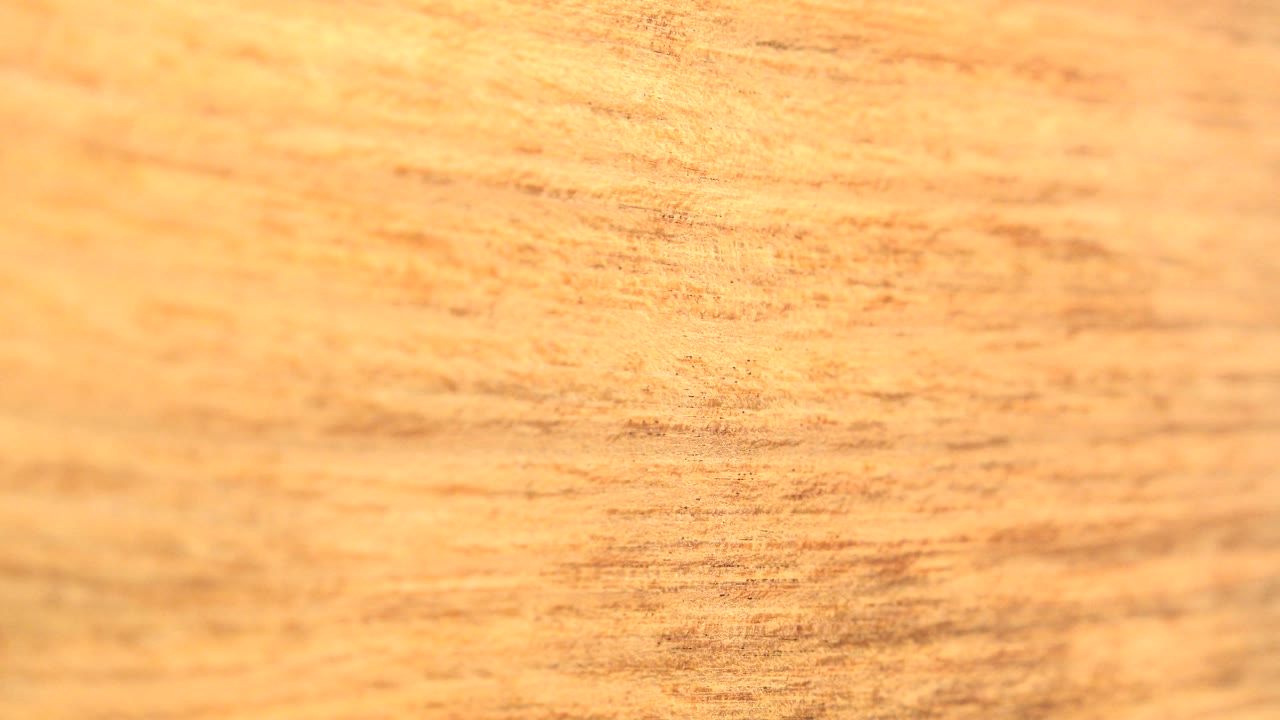 Close view of warm orange wood-like grain