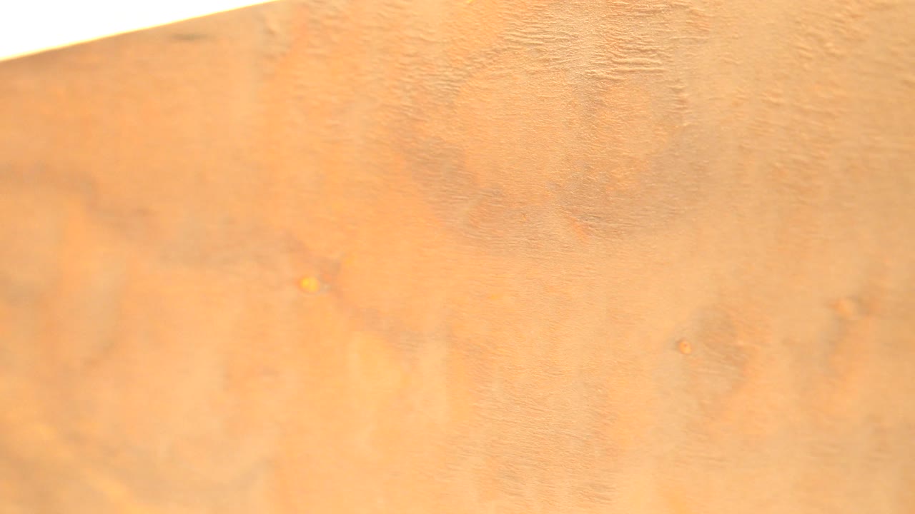 Yellow wood surface with grain and knots