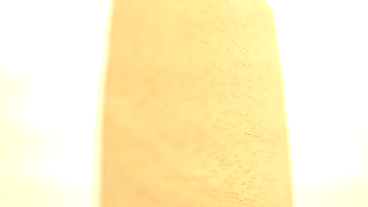 Vertical yellow object edge with white background