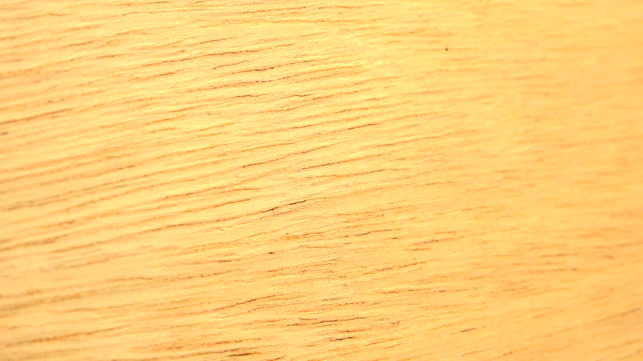 A brighter section of yellow wood texture fills the Westminster, Colorado frame, with fine grain lines and no visible people.