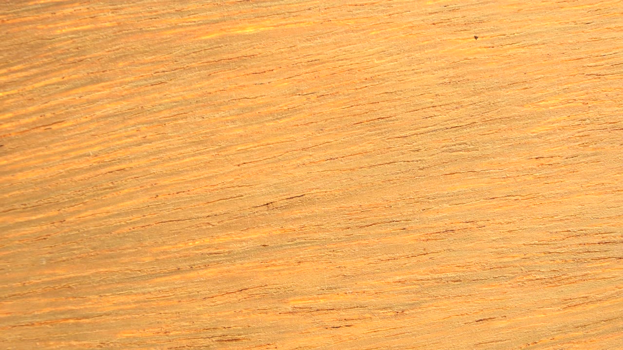 Darker wood grain band across the frame