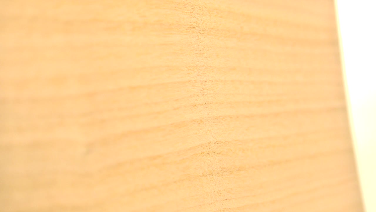 Wood board surface angled against bright white background