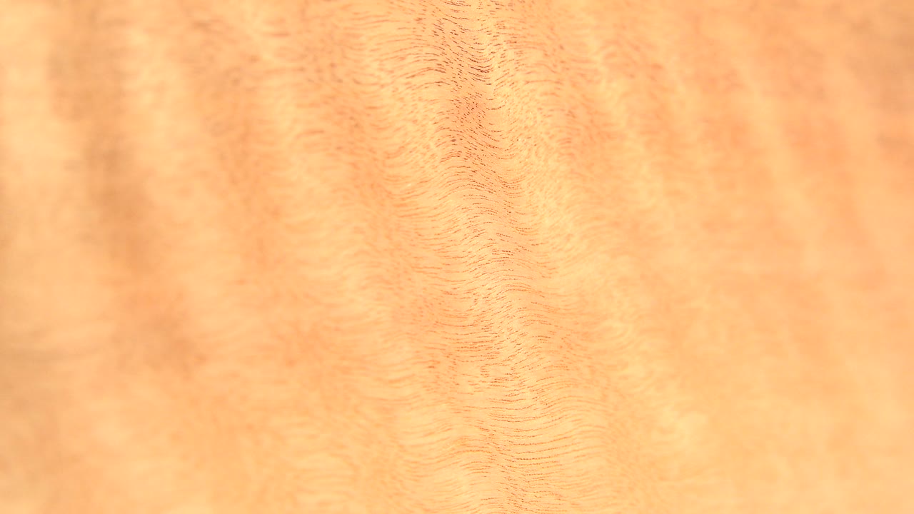 Orange tan wood grain filling the close-up frame