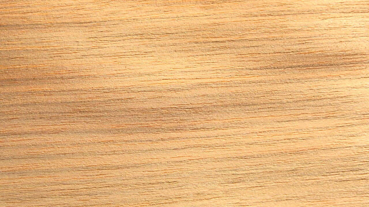 Close view of a warm wooden board surface in Westminster, Colorado footage, with horizontal grain filling the frame and no visible people.