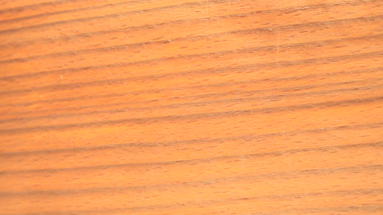 A blurred yellow object edge sits beside a blown-out white vertical band in Westminster, Colorado 2015 footage, with no visible people.
