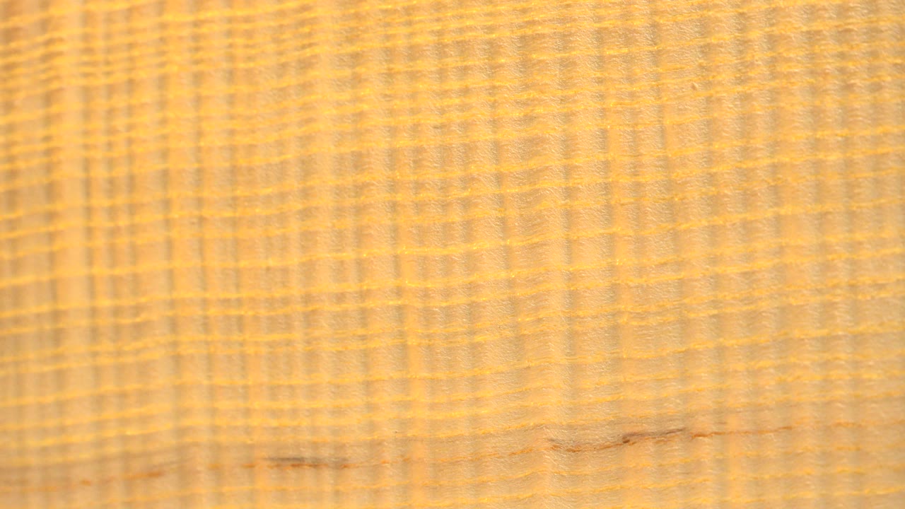 Close yellow textured surface filling the frame