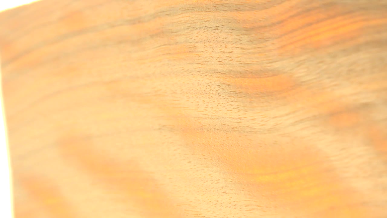 A close-up view of the shiny gold plate fills the frame in Westminster, Colorado, with warm reflections and no visible people.