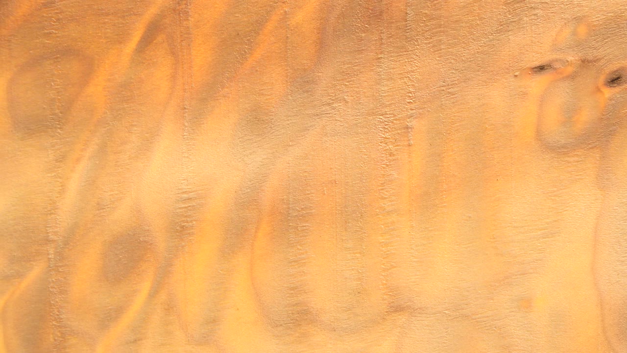 Orange plaster texture with darker mottled area on the right.