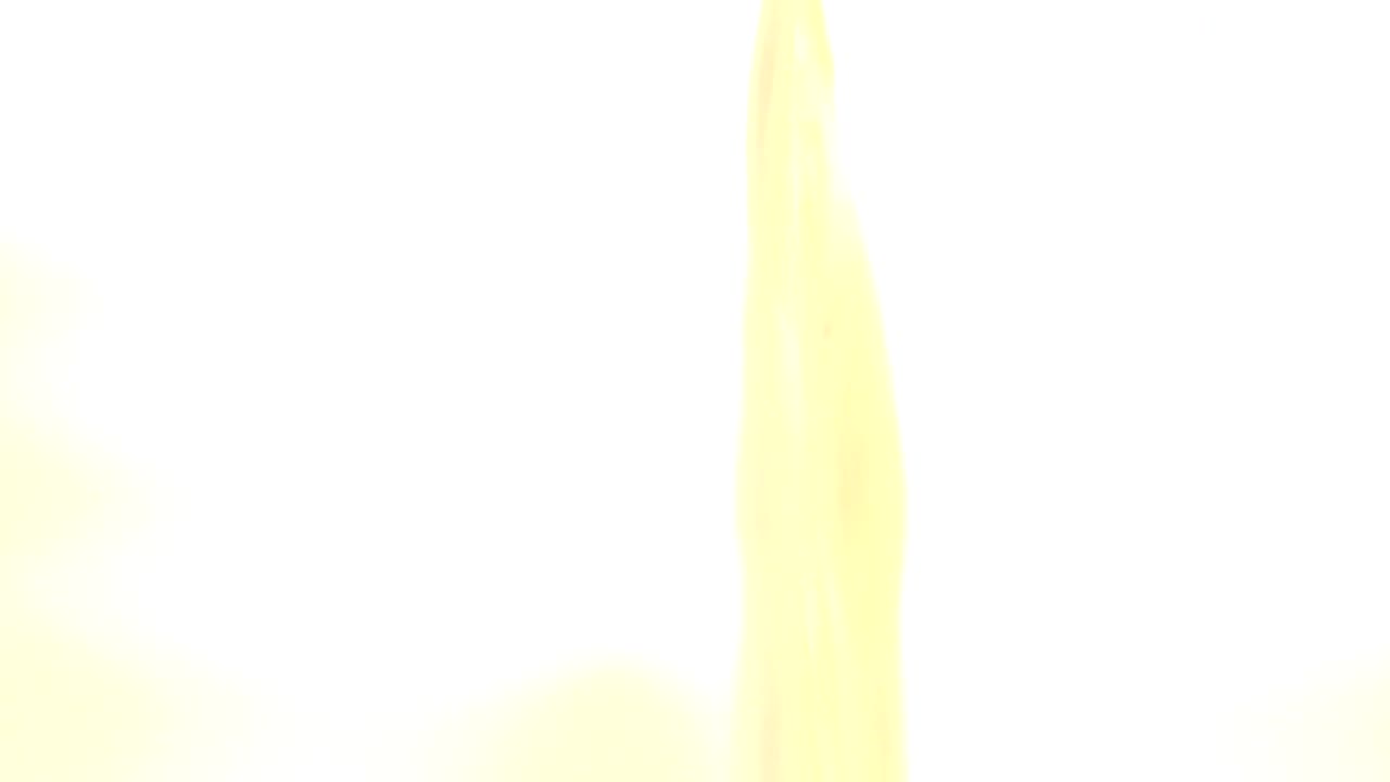 Mostly white overexposed frame with a narrow yellow-gold vertical shape.