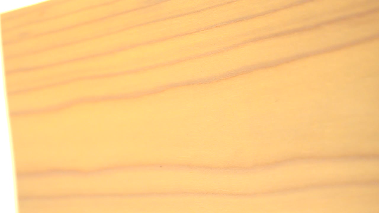 At 0:00, a pale yellow abstract graphic fills the Westminster, Colorado 2015 frame with soft orange horizontal streaks and no visible people.