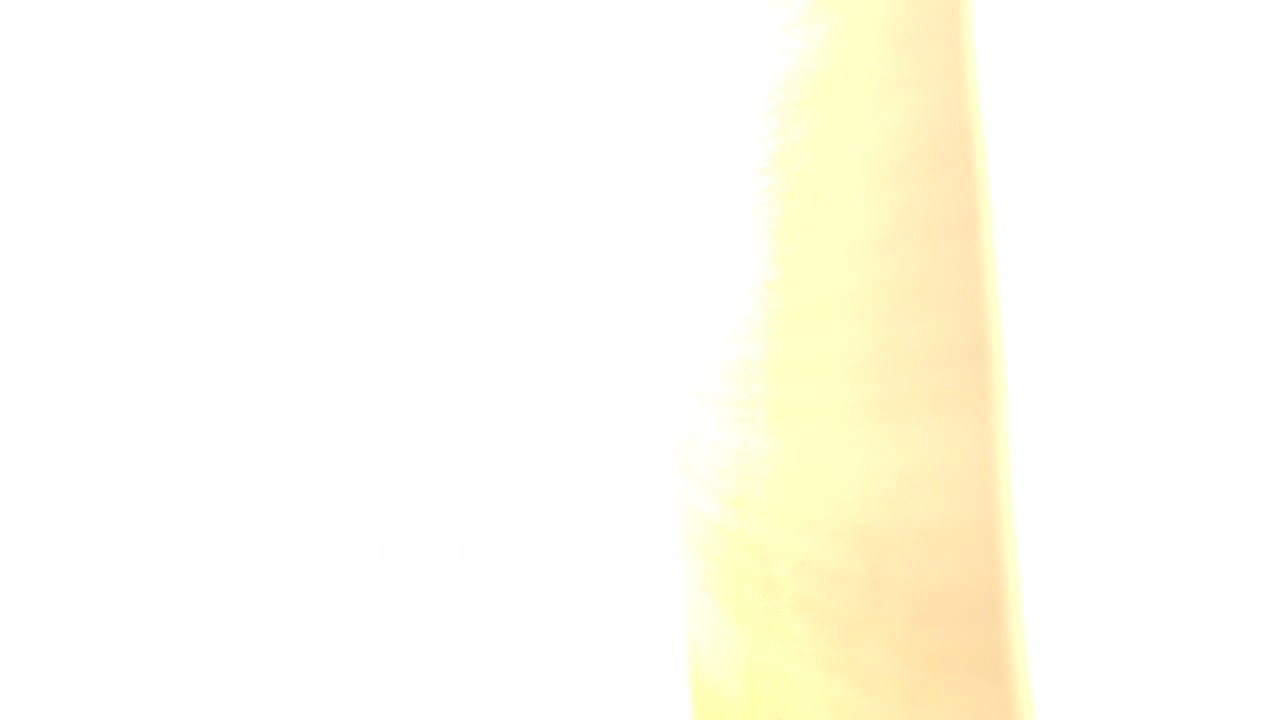 Mostly white overexposed frame with a pale yellow vertical strip.