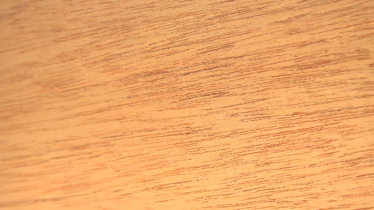 Soft yellow-orange close-up over wood