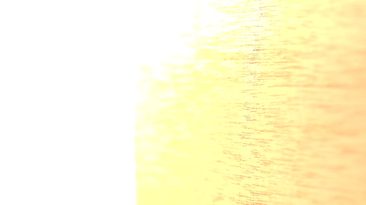 A yellow wood surface appears closer and brighter in the Westminster, Colorado clip, with grain running across the frame, a white vertical strip at left, and no visible people.