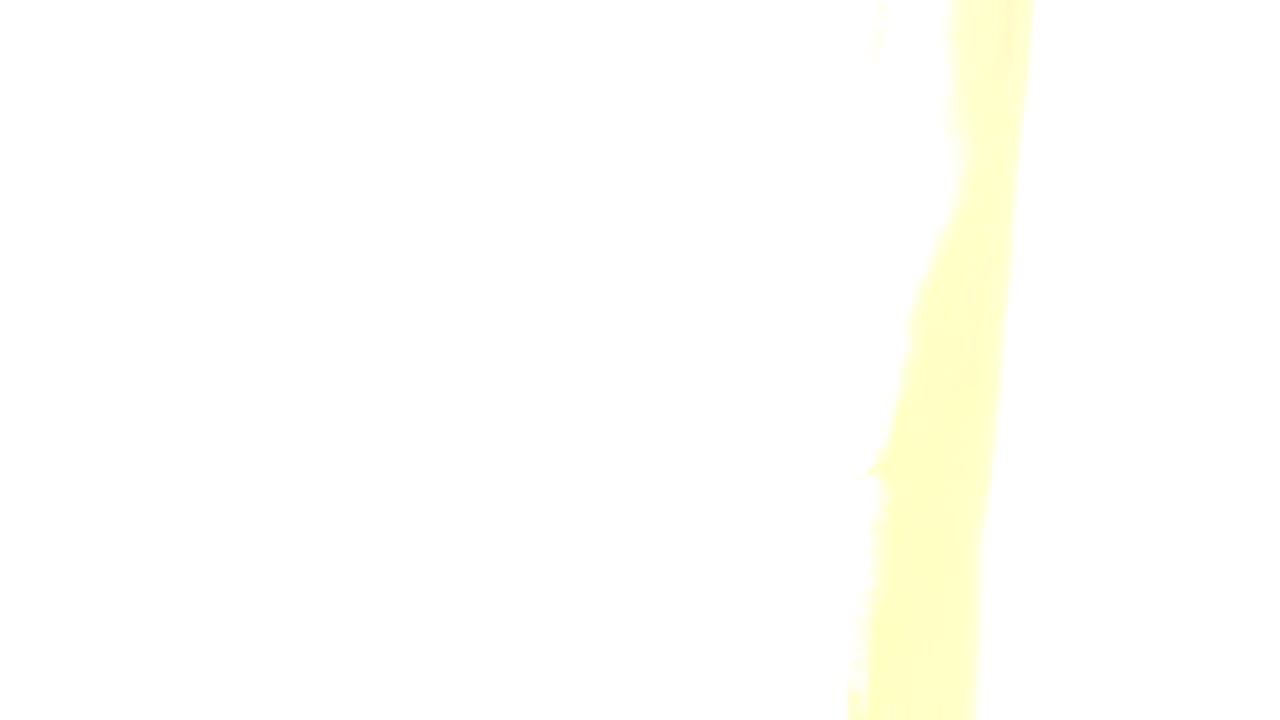 Opening frame from Westminster, Colorado shows a wooden surface along the lower edge beneath large overexposed white and yellow light bands, with no visible people.