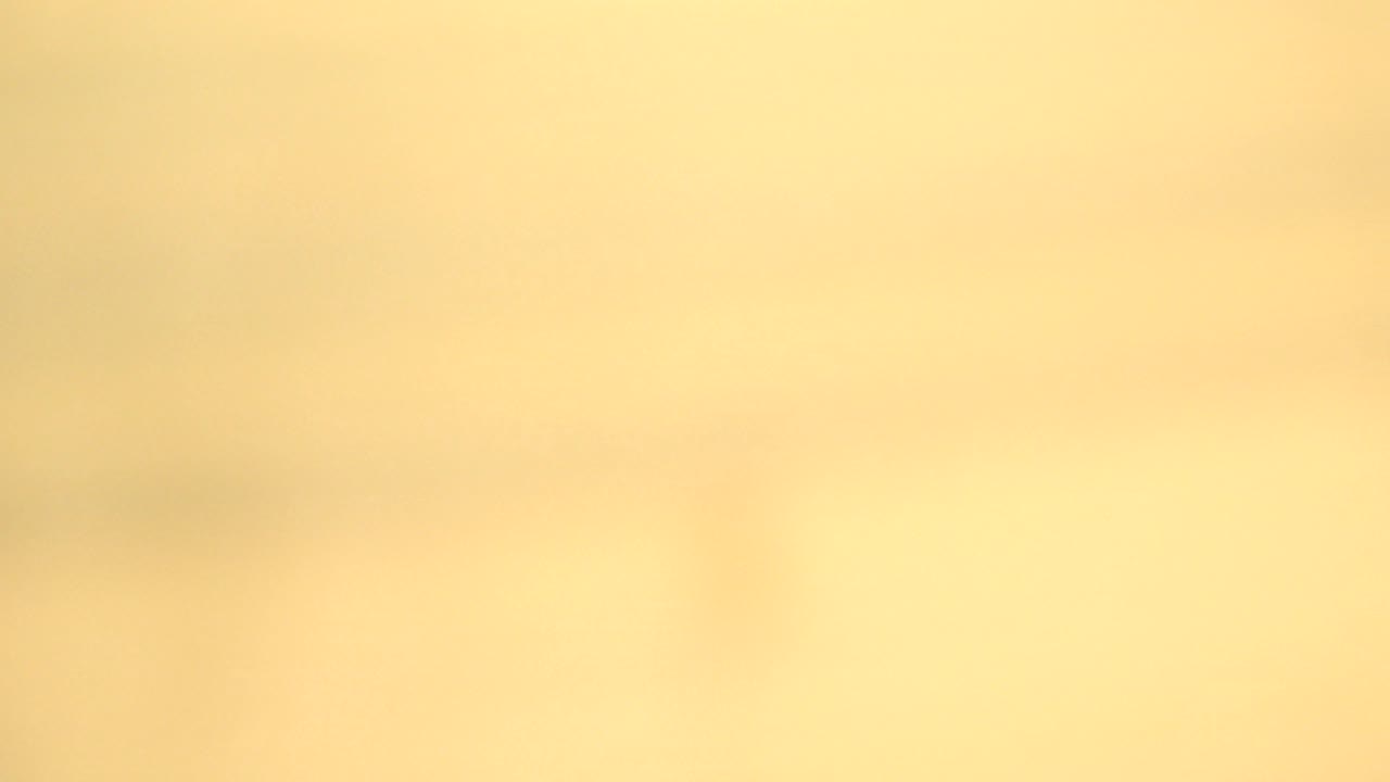 Bright yellow tan abstract surface with very soft detail.